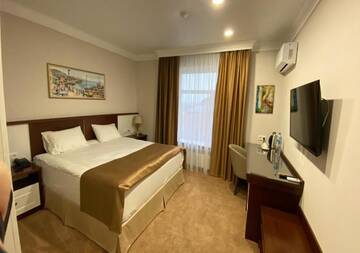Фото номера Улучшенный двухместный номер с 1 кроватью Отель Boutique Hotel Kaspi г. Темиртау 4