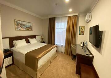 Фото номера Улучшенный двухместный номер с 1 кроватью Отель Boutique Hotel Kaspi г. Темиртау 6