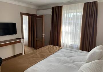 Фото номера Семейный люкс Отель Boutique Hotel Kaspi г. Темиртау 3