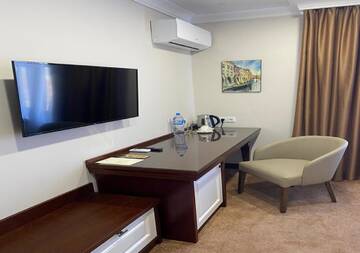 Фото номера Улучшенный двухместный номер с 2 отдельными кроватями Отель Boutique Hotel Kaspi г. Темиртау 4